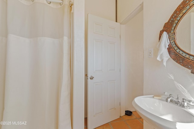 bathroom featuring tile patterned flooring and sink