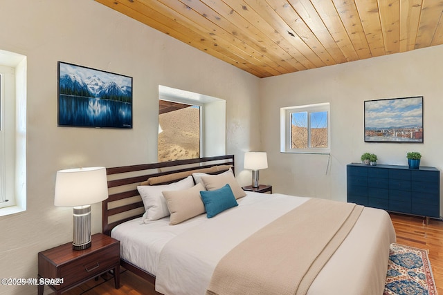 bedroom featuring hardwood / wood-style floors and wooden ceiling