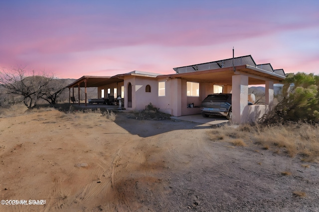 view of front facade featuring a carport