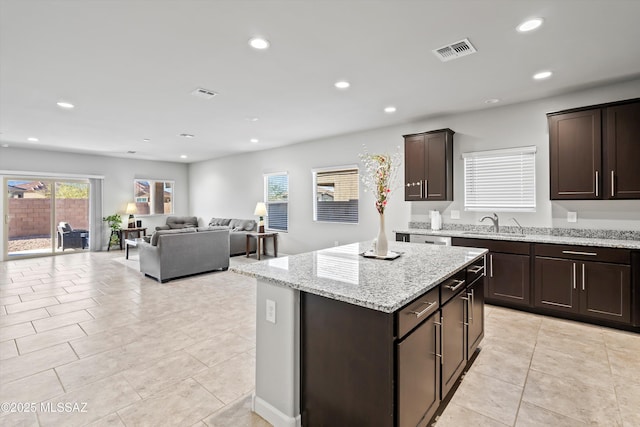 kitchen featuring dark brown cabinets, visible vents, and recessed lighting