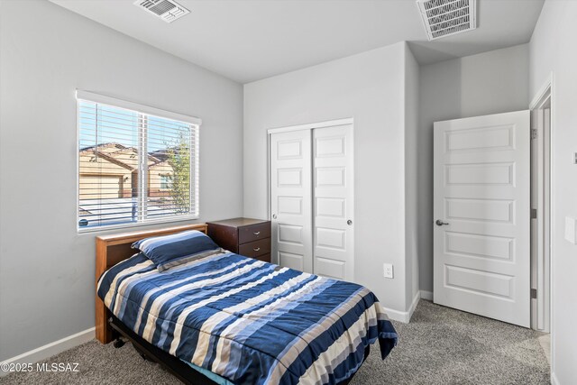 bedroom featuring carpet flooring, baseboards, and visible vents