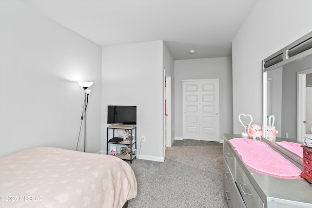 carpeted bedroom with baseboards