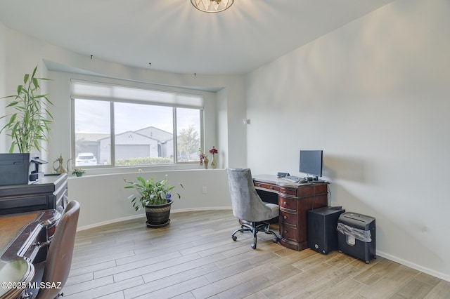 office space with light hardwood / wood-style flooring