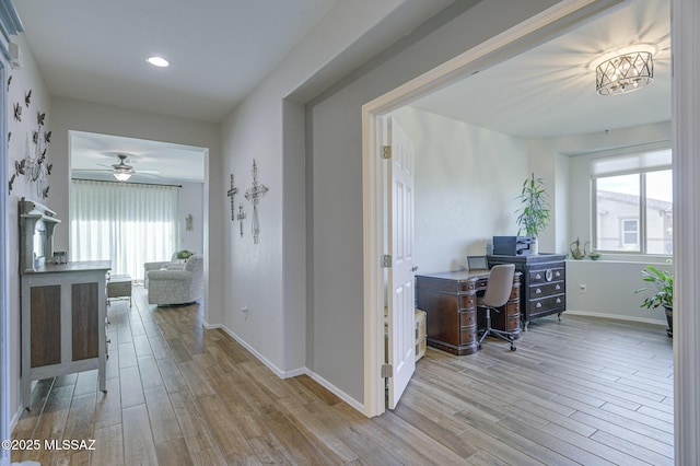 hall with light wood-type flooring