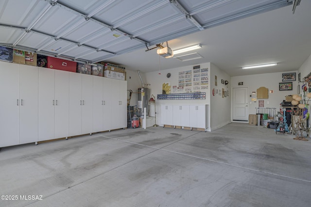 garage with a garage door opener and gas water heater