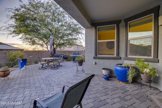 patio terrace at dusk with grilling area