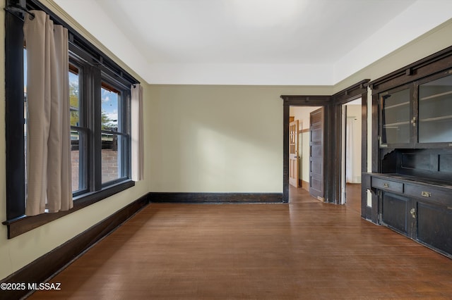 empty room featuring dark hardwood / wood-style flooring