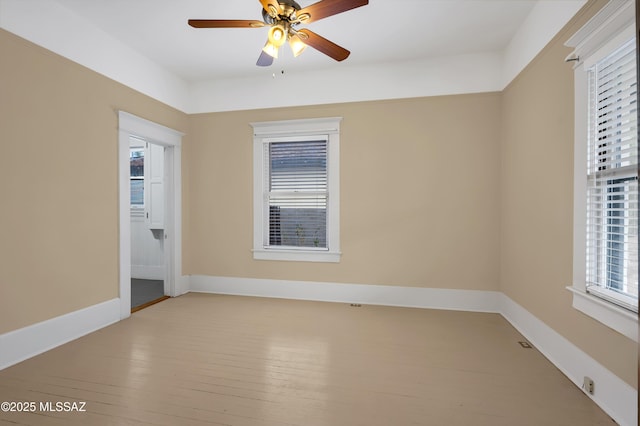 unfurnished room featuring ceiling fan and light wood-type flooring