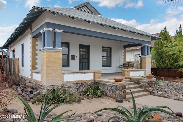 view of front of property featuring covered porch