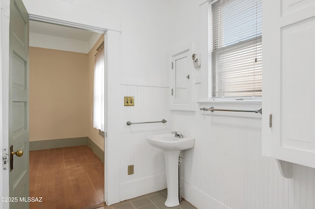 bathroom with hardwood / wood-style floors