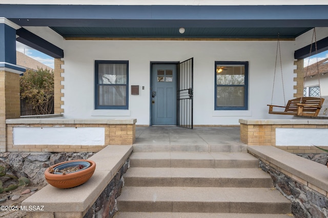 doorway to property featuring a porch