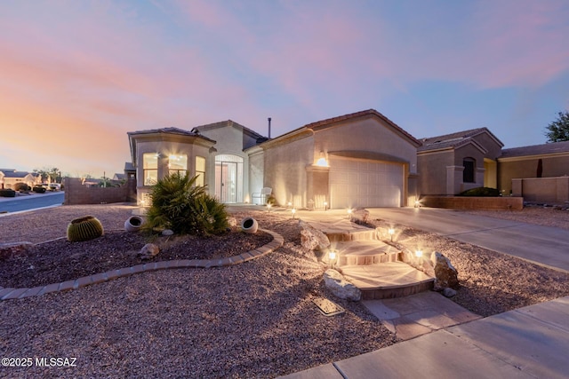 mediterranean / spanish house featuring a garage