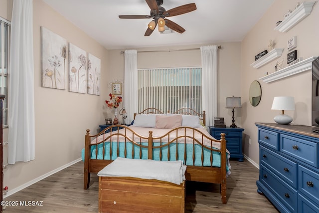 bedroom featuring wood-type flooring and ceiling fan