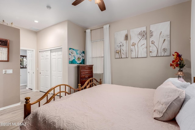 bedroom featuring a closet, ceiling fan, and light hardwood / wood-style flooring