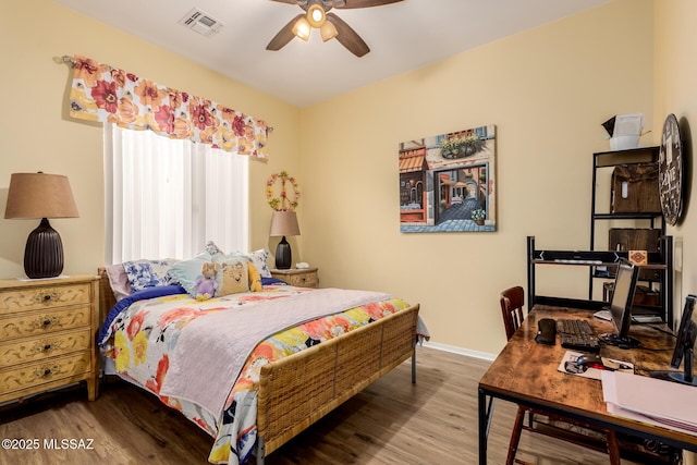 bedroom featuring hardwood / wood-style floors and ceiling fan