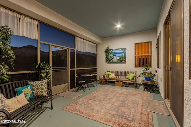 living area with concrete floors