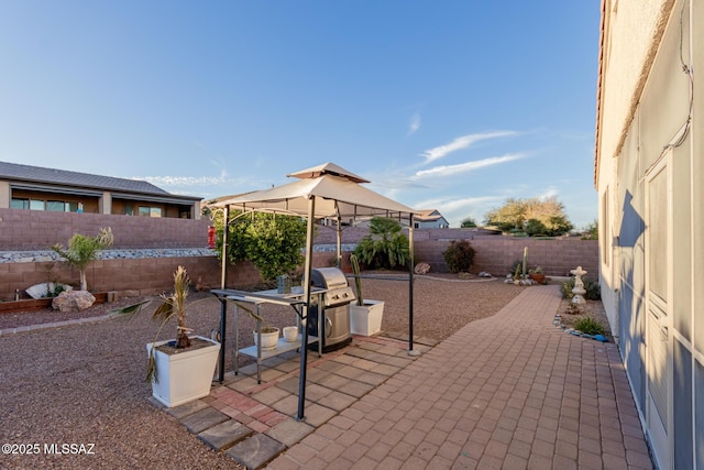 view of patio / terrace with a gazebo and a grill