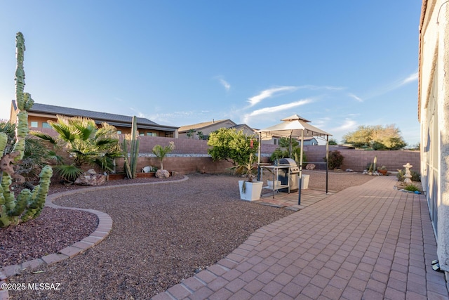 view of yard with a gazebo and a patio area