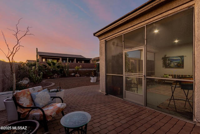 view of patio terrace at dusk