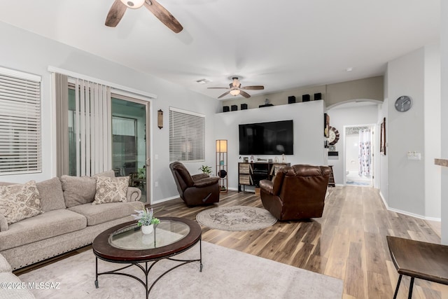 living room with ceiling fan and wood-type flooring