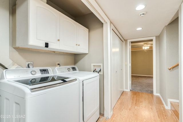 laundry area with cabinets, ceiling fan, light wood-type flooring, and independent washer and dryer