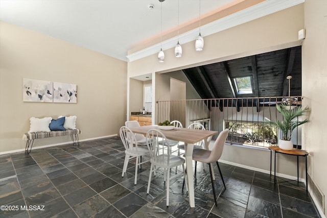 dining area featuring a healthy amount of sunlight and a skylight