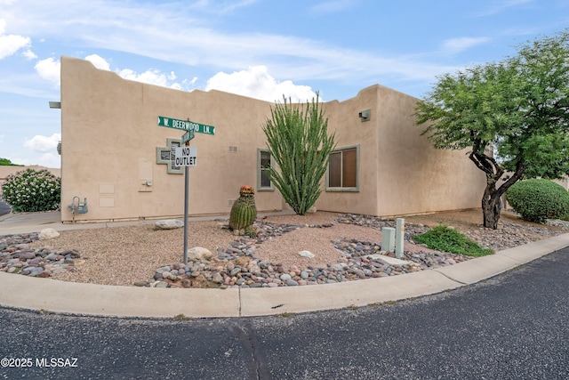 view of front of house featuring stucco siding