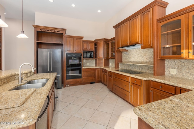 kitchen with black appliances, a sink, open shelves, under cabinet range hood, and hanging light fixtures