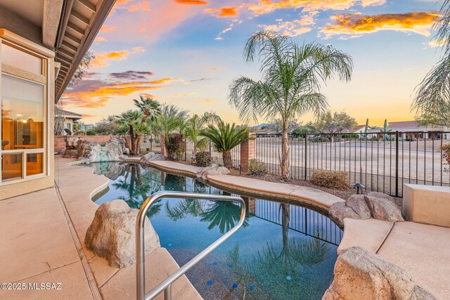 outdoor pool featuring a patio and ceiling fan