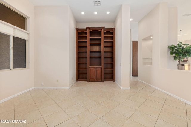 unfurnished room featuring recessed lighting, visible vents, baseboards, and tile patterned flooring