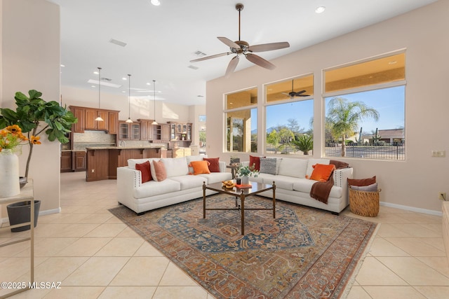 living area with visible vents, light tile patterned floors, recessed lighting, and baseboards