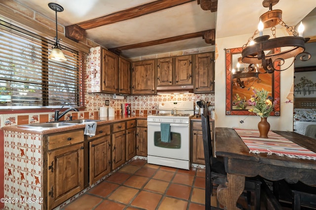 kitchen with brown cabinets, white gas stove, beamed ceiling, decorative light fixtures, and tasteful backsplash