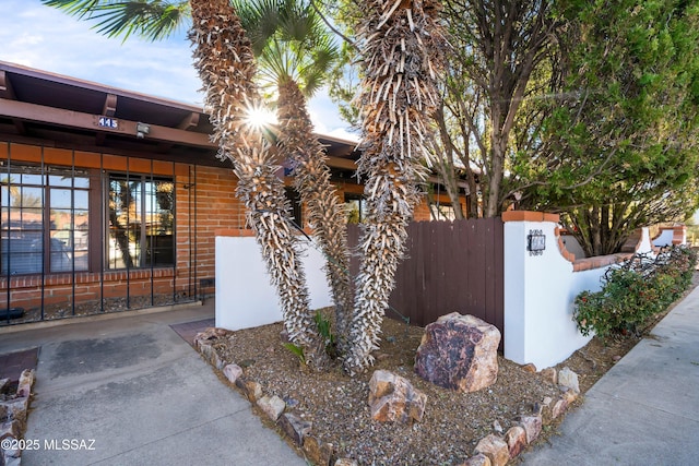 445 S Paseo Quinta Unit C, Green Valley, AZ 85614 - view of home's exterior with a fenced front yard and a gate