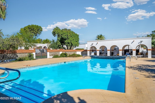 view of swimming pool featuring a patio