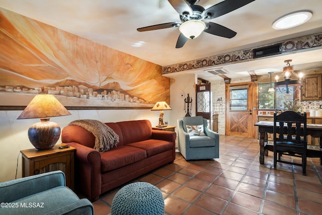 living room featuring tile patterned floors and ceiling fan