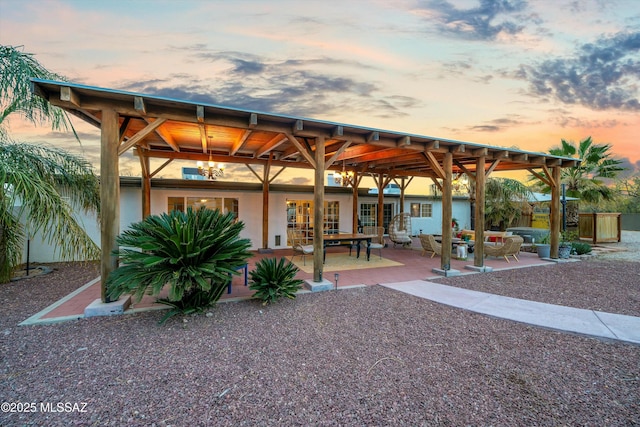 view of patio terrace at dusk