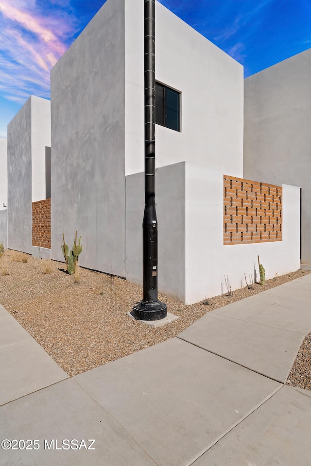 view of property exterior at dusk