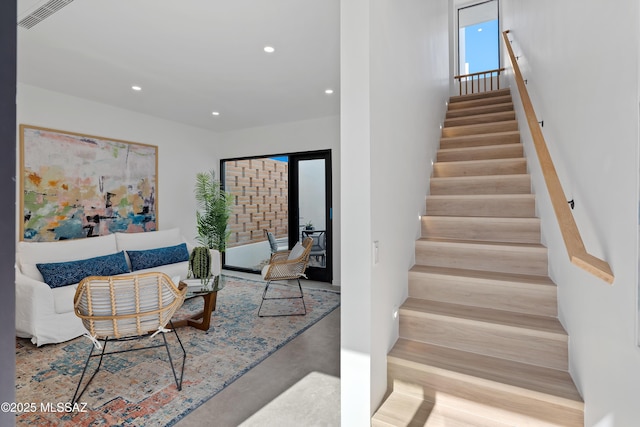 staircase featuring concrete floors