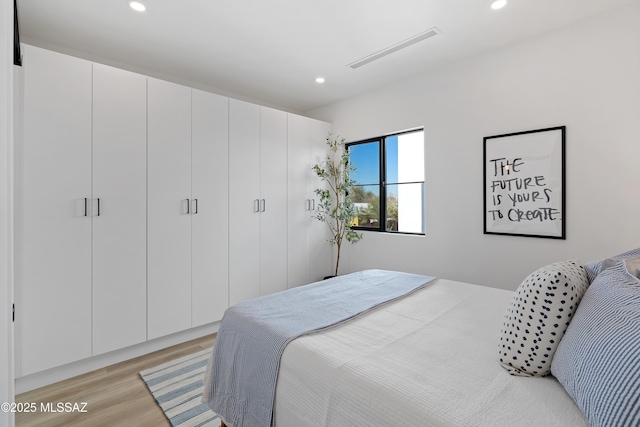 bedroom with light wood-type flooring