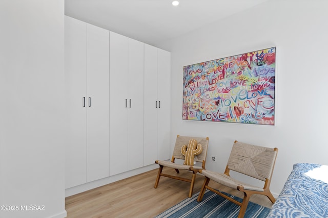 sitting room featuring light hardwood / wood-style floors