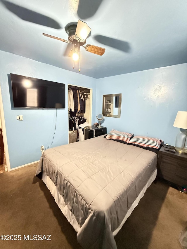 carpeted bedroom with a closet and ceiling fan
