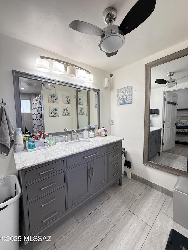 bathroom featuring vanity and ceiling fan