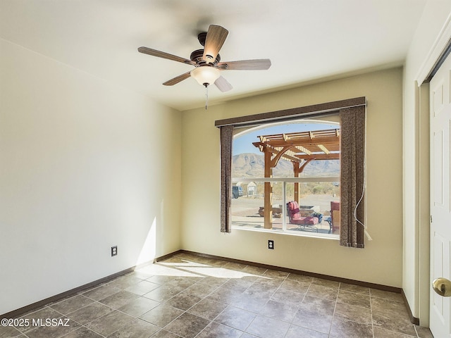 unfurnished room featuring ceiling fan