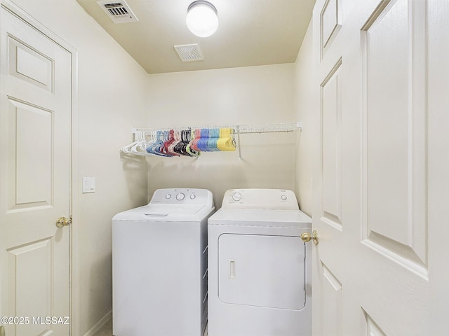 washroom featuring washer and clothes dryer