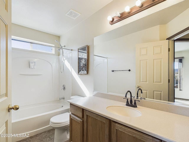 full bathroom with vanity, bathtub / shower combination, tile patterned floors, and toilet