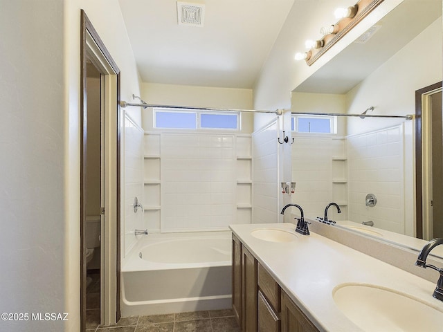 bathroom featuring vanity, tile patterned floors, and shower / bathtub combination