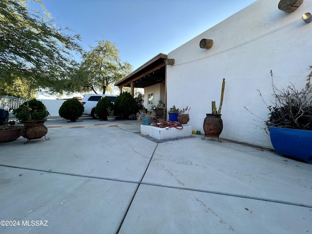 view of property exterior featuring a patio area