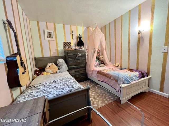 bedroom with wood-type flooring