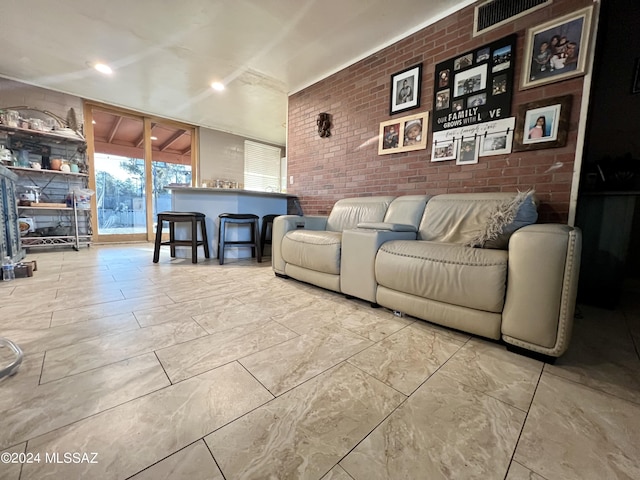 living room with brick wall