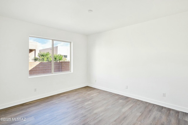 empty room with light wood-type flooring